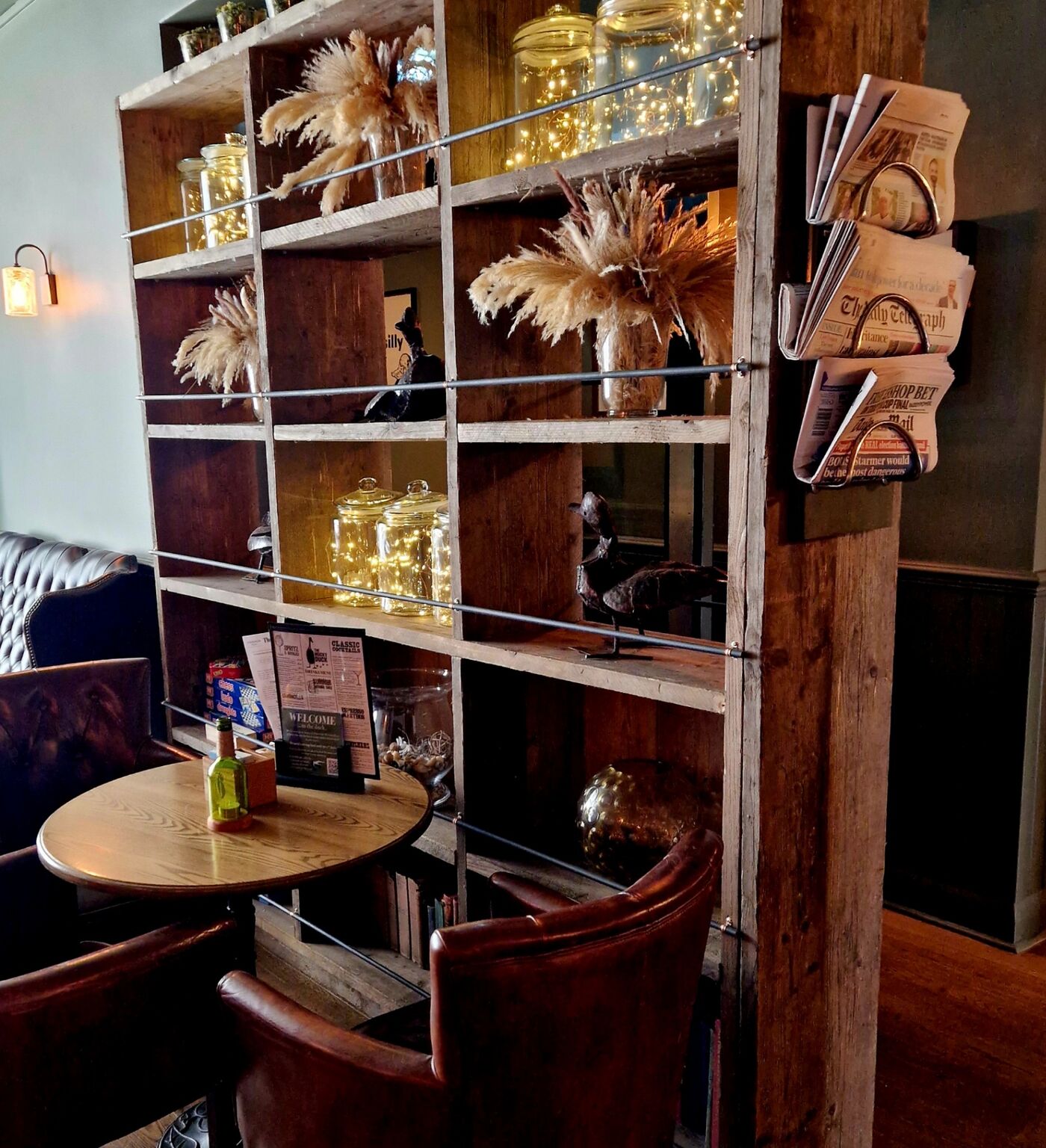 Shelving and cosy seating inside The Mucky Duck